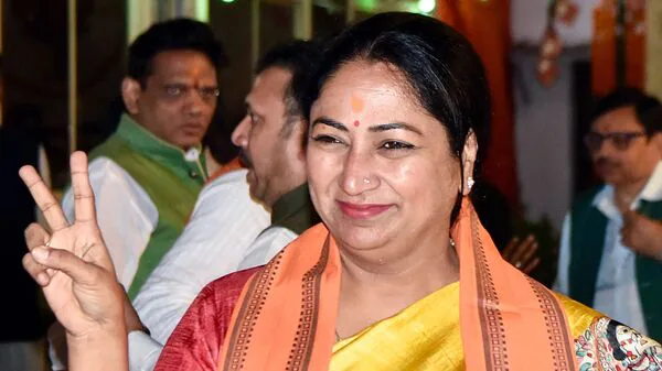 BJP leader Rekha Gupta, the chief minister of Delhi, speaking at a public gathering